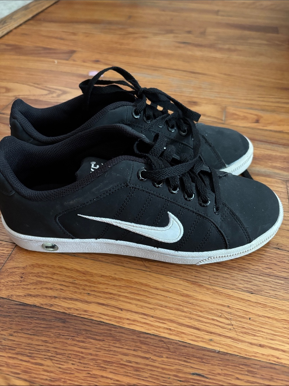 Nike Black Low-Top Sneakers with White Swoosh Accent